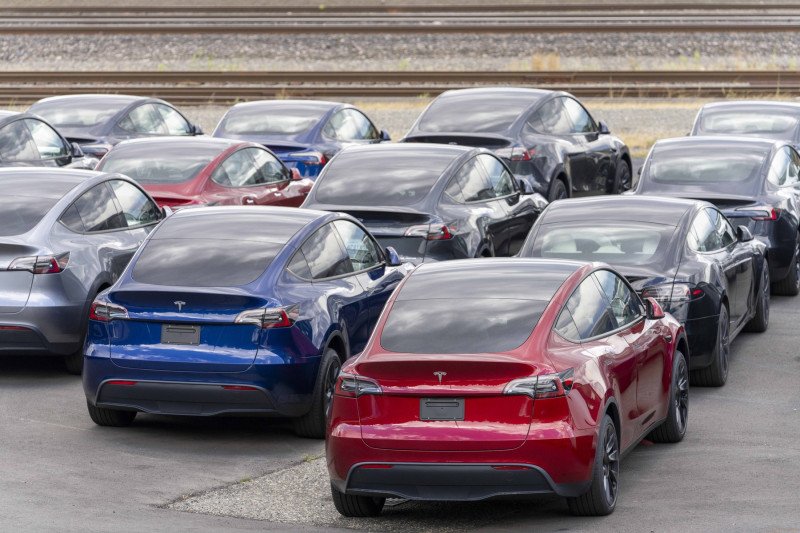 New Tesla cars and Cybertrucks in storage lot