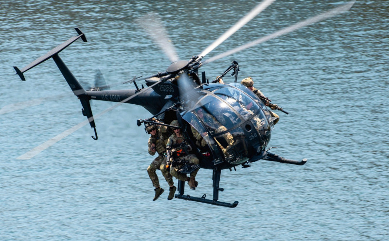 Tampa, United States. 18th May, 2022. U.S. Special Operations Forces commandos perform an attack maneuver in an Army MH-6 helicopter during a public demonstration as part of SOF Week, May 18, 2022 in Tampa, Florida. Credit: SSgt. Alexander Cook/U.S. Air F